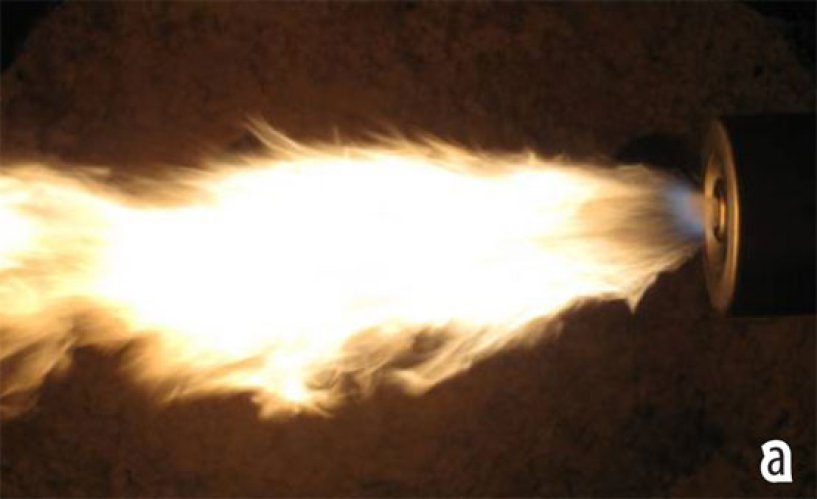Figure 3: Messer liquid atomisation lance with oxygen. a) Flame in trial furnace.